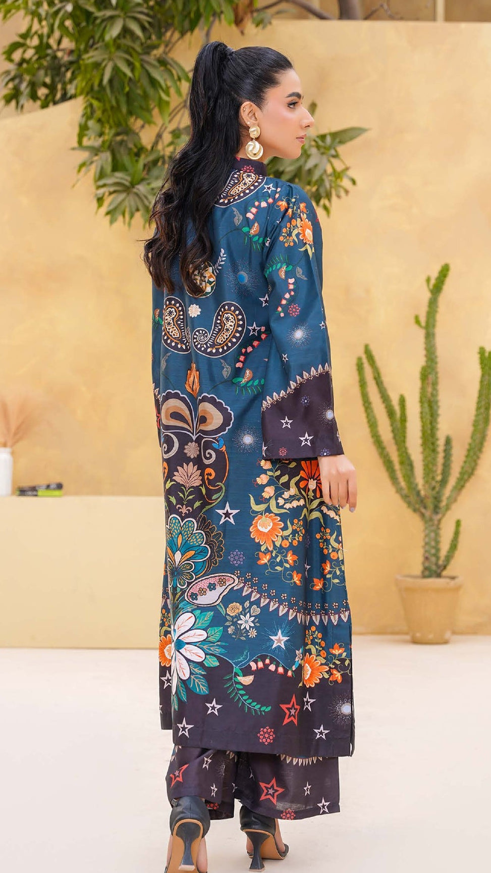 Woman wearing a floral dress with a neutral background