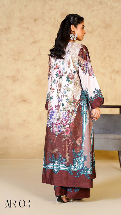 Woman wearing a floral dress with a brown base, standing in front of a beige wall.